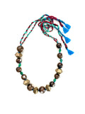 Chunky. Tribal. Upcycled.              Handmade in Lebanon unique piece necklace, with materials sourced over travels, made of antique wood beads inlaid with mother of pearl, brass geometric elements and malachite stones.Recycled saris fabric for adjustable length. 