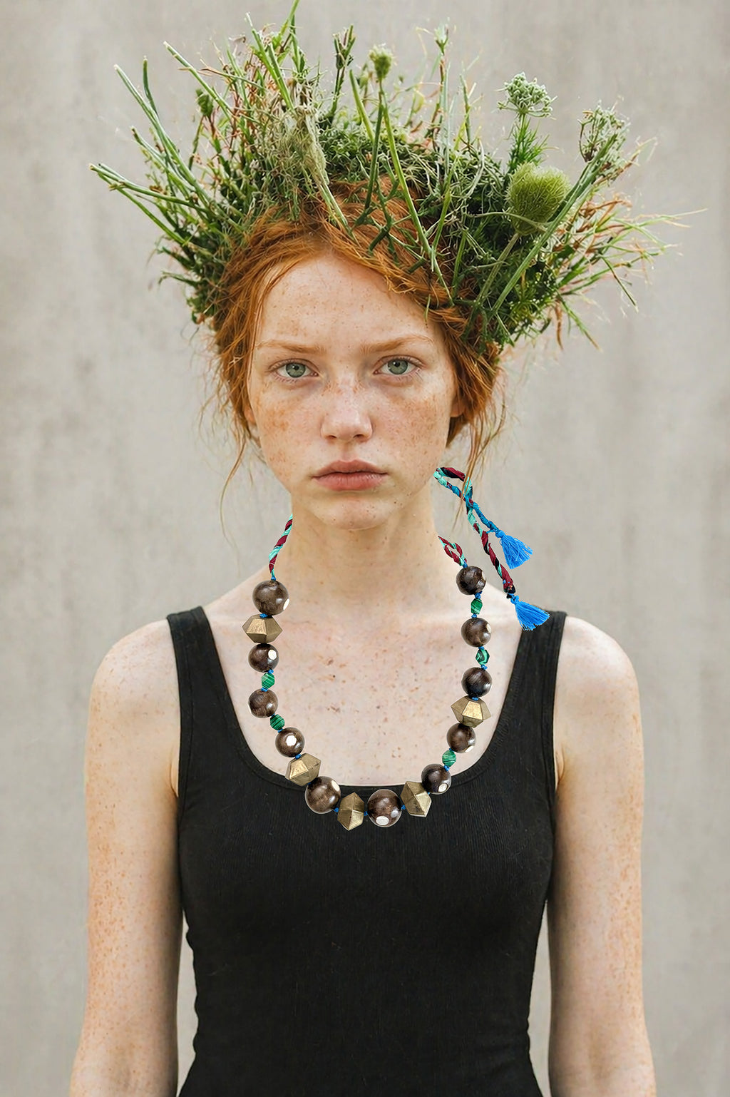 Chunky. Tribal. Upcycled.              Handmade in Lebanon unique piece necklace, with materials sourced over travels, made of antique wood beads inlaid with mother of pearl, brass geometric elements and malachite stones.Recycled saris fabric for adjustable length. 