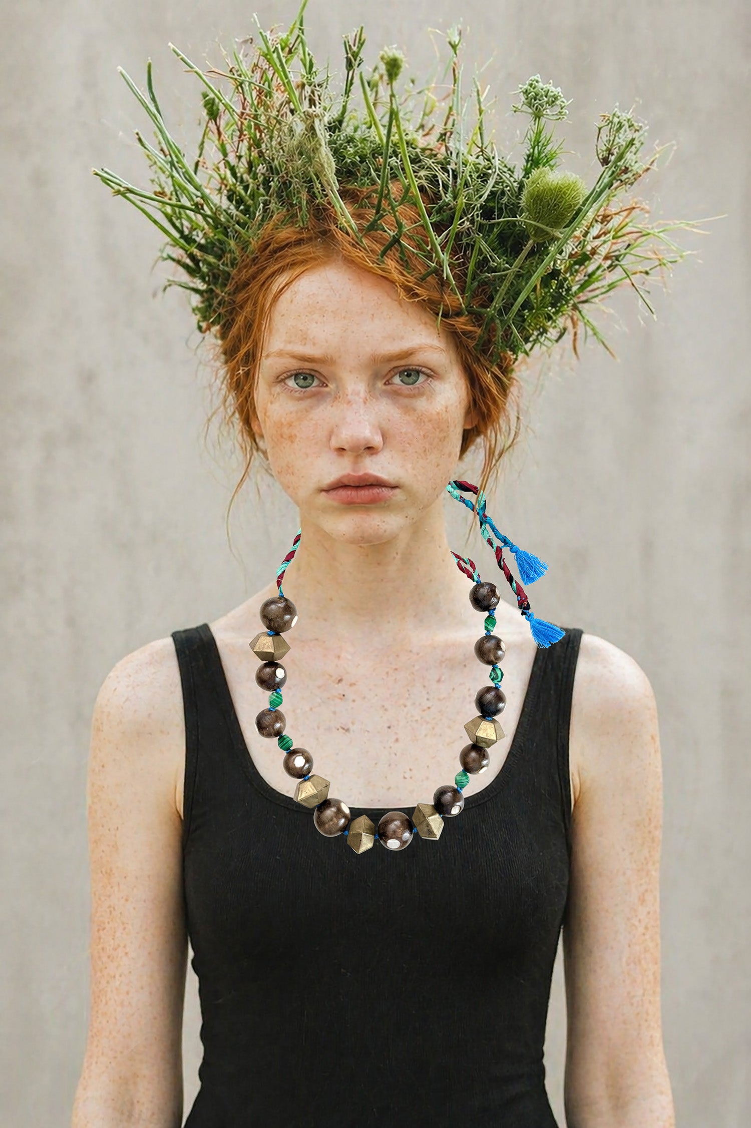 Chunky. Tribal. Upcycled.              Handmade in Lebanon unique piece necklace, with materials sourced over travels, made of antique wood beads inlaid with mother of pearl, brass geometric elements and malachite stones.Recycled saris fabric for adjustable length. 