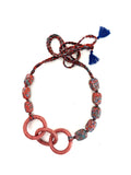 TRINITY Texture over sparkle. Presence over excess.                                   Handcrafted with Venetian millefiori trade beads, interlocked leather rings, and adjustable braided cotton threads.

Three rings, endless character.