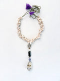 MAREA Collected by the sea. Worn with intention.

Pièce unique — handmade with natural sea shells, howlite, agate, and amethyst stones &nbsp;and a pumice pendant inlaid with mother of pearl.

Nature's architecture. Human hands.
