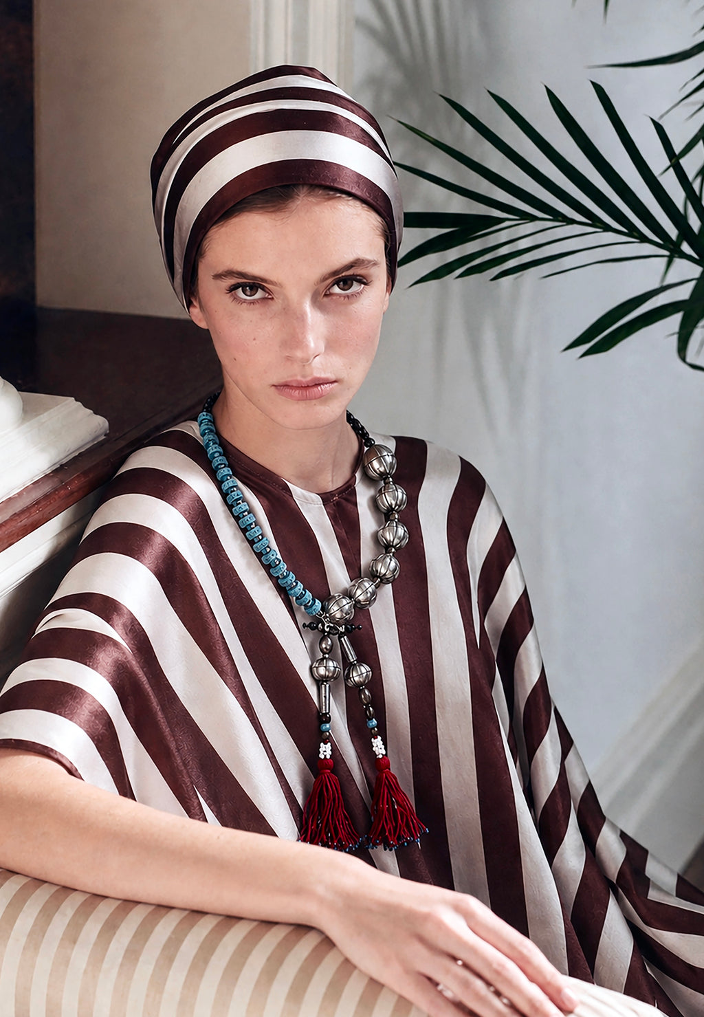 Pièce unique necklace, handmade in Lebanon with adjustable braided cotton threads, metal, ceramics, lava beads and aquamarine stones. Finished with deep Ottoman crimson tassels.

Raw elements. Refined construction.